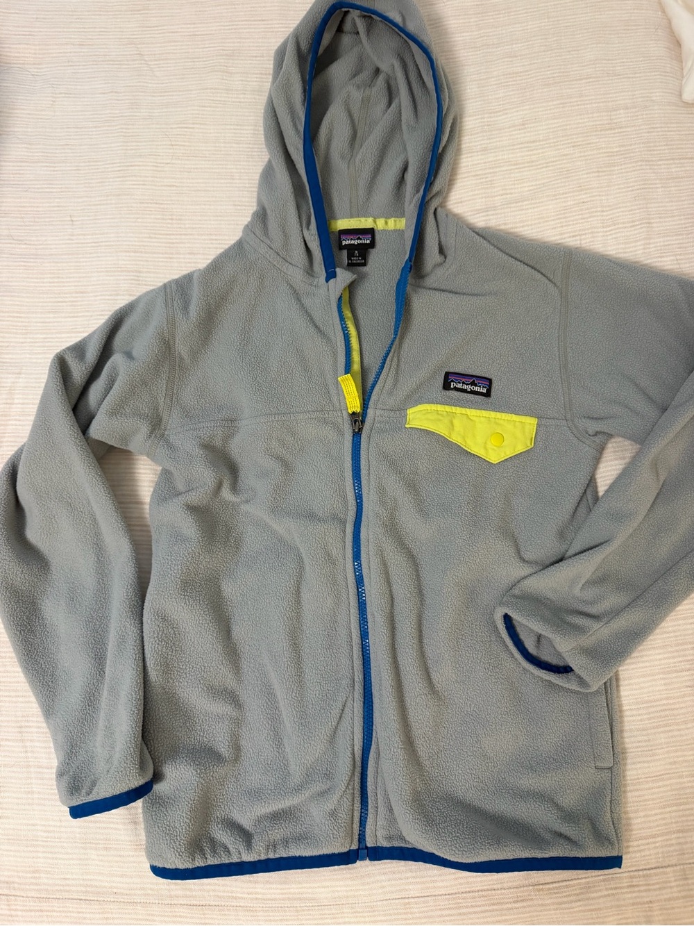 Patagonia Kids Light Gray Fleece Hoodie with Blue Trim and Neon Yellow Pocket